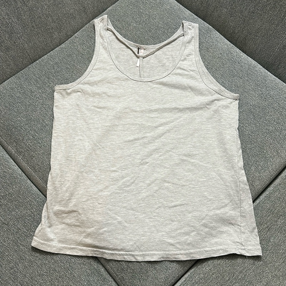 Poof! Super cute tank top size large with adorable neckline
